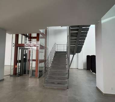 Interior commercial space with steel stair finishing works